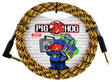 The image shows a Pig Hog guitar cable with a yellow and black braided exterior, gold-plated 1/4" connectors, and black housings. The packaging features the Pig Hog logo with a red pig mascot dressed in a blue tracksuit holding a boom box, set against colorful graffiti-style lettering and a brick wall background. The 10 FT cable is known for durability and quality, favored by musicians for reliable instrument connections.