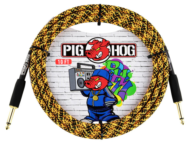 The image shows a 10-foot Pig Hog instrument cable with a yellow and black braided design for durability. It features 1/4" gold-plated phone plug connectors on both ends, suitable for electric guitars, basses, and keyboards. The packaging displays the Pig Hog logo with a pig mascot holding a boombox against a graffiti-style brick wall, highlighting the brand’s reputation for reliable, road-worthy cables.