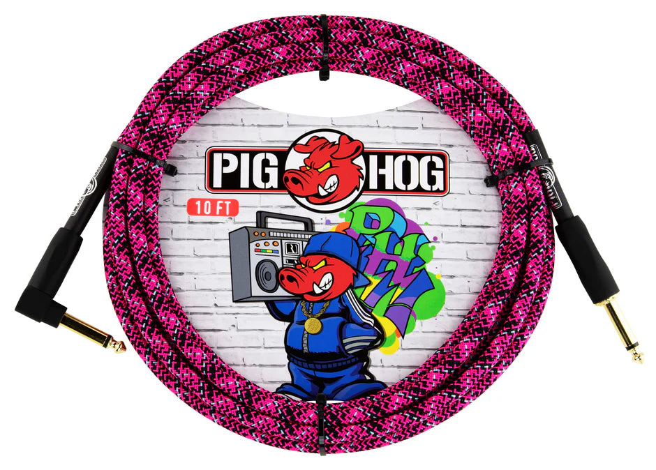 The image shows a Pig Hog 10-foot guitar cable with a bright pink and black braided fabric exterior and gold-plated 1/4" connectors. The packaging features the Pig Hog logo with a red pig mascot and graffiti-style artwork of a pig with a boombox, reflecting an urban street art vibe. This durable, high-quality cable is designed for electric guitars and basses, combining bold style with reliable performance.