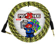 The image shows a coiled 10-foot Pig Hog instrument cable with a yellow and black snakeskin-patterned braided jacket. It features gold-plated 1/4" connectors—one straight and one right-angle—ideal for guitars. The cable rests against packaging displaying the Pig Hog logo with a red pig mascot and colorful graffiti on a brick wall. Known for durability, this cable is popular among musicians for connecting electric instruments to amps or pedals.