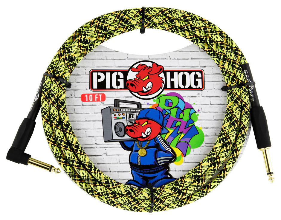 The image shows a coiled 10-foot Pig Hog instrument cable with a yellow and black snakeskin-patterned braided jacket. It features gold-plated 1/4" connectors—one straight and one right-angle—ideal for guitars. The cable rests against packaging displaying the Pig Hog logo with a red pig mascot and colorful graffiti on a brick wall. Known for durability, this cable is popular among musicians for connecting electric instruments to amps or pedals.