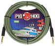 The image shows a 10-foot Pig Hog "Jamaican Green" vintage instrument cable with a green and black woven design, gold-plated 1/4" connectors, and the red pig mascot logo. The packaging features colorful space-themed artwork with the mascot on a yacht. This durable, professional-grade cable is used for connecting guitars, basses, keyboards, and other instruments to amplifiers or audio equipment.