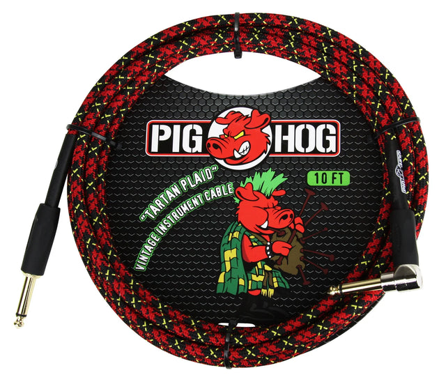 The image shows a 10-foot Pig Hog "Tartan Plaid" vintage-style instrument cable with a red and black plaid woven exterior and yellow stitching. It has standard 1/4" plugs (one straight, one right-angle) for connecting guitars or keyboards to amps or pedals. The Pig Hog branding with its red pig logo is visible on the packaging. The cable combines a classic look with durable protection for reliable signal transmission.