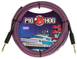 The image shows a Pig Hog "Riviera Purple" 10-foot instrument cable. It features a purple and black braided jacket, gold-plated 1/4" connectors, and Pig Hog’s red pig mascot logo. The vintage-style packaging has a nautical theme with a yacht and the pig wearing sunglasses. Known for durability and professional quality, this cable is designed for electric guitars, basses, and other instruments.