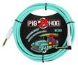 The image shows a Pig Hog "Seafoam Green" 10-foot vintage instrument cable with 1/4" connectors—one straight and one right-angle plug. It features Pig Hog’s red pig mascot and retro packaging with a vintage truck. The seafoam green color offers a classic look, ideal for guitarists and bassists needing a durable, stylish cable that fits securely with amps and pedals.