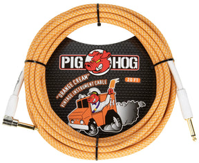 The image shows a Pig Hog "Orange Cream" vintage 20-foot instrument cable with an orange and white braided exterior. It has 1/4" connectors—one straight and one right-angle—ideal for guitars and other instruments. The packaging features Pig Hog’s pig mascot driving a vintage truck, reflecting a fun, retro automotive theme. Known for durable, colorful cables, Pig Hog is popular among musicians for connecting instruments to amps or pedals.