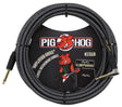 The image shows a Pig Hog "Amplifier Grill" 20-foot instrument cable with a coiled black woven exterior for durability. It has gold-plated 1/4" connectors on both ends and features the Pig Hog logo with a red pig mascot. The packaging depicts the pig playing guitar by an amplifier stack. This professional-grade cable is designed for electric guitars, basses, and other instruments, offering interference protection suitable for live and studio use.