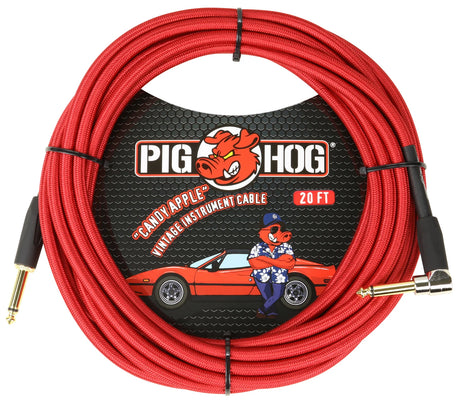 The image shows a Pig Hog "Candy Apple" vintage-style 20-foot instrument cable with a red woven exterior and gold-plated connectors—one straight and one right-angle 1/4" plug. The cable is coiled with black ties, and the packaging features Pig Hog’s pig mascot in vintage attire beside a classic red sports car. This high-quality cable is ideal for guitars, basses, and keyboards, carrying audio signals to amps or pedals.