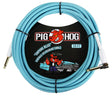 The image shows a 20-foot Pig Hog instrument cable in "Daphne Blue," featuring a woven light blue exterior and 1/4" phone plug connectors. It has a vintage-inspired design with professional-grade braided jacket. The label displays Pig Hog's red pig mascot riding a vintage car. This colorful, high-quality cable connects electric guitars, basses, and other instruments to amplifiers or audio gear.