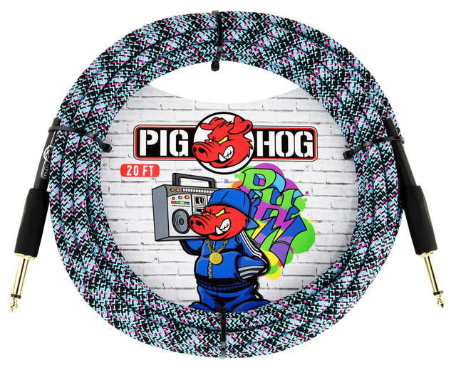 The image shows a Pig Hog 20-foot instrument cable with a colorful woven fabric sleeve in black, white, pink, and teal. It has gold-plated 1/4" connectors on both ends. The packaging features the Pig Hog logo with a red pig mascot and graffiti-style artwork on a brick wall, giving an urban, street art look. This premium cable is designed for reliable performance and distinctive style.