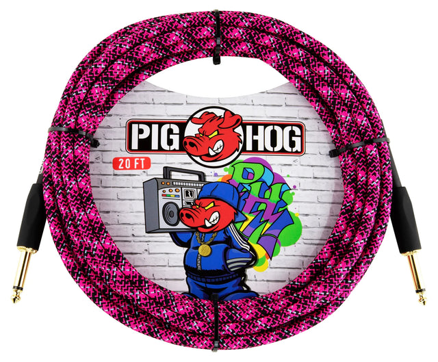 The image shows a Pig Hog 20-foot instrument cable with a pink and black braided jacket for durability and tangle resistance. It has gold-plated 1/4" connectors on both ends and features Pig Hog branding with a colorful pig mascot and graffiti-style text on the packaging. This high-quality cable is ideal for connecting guitars, basses, and keyboards to amps or pedals, favored for its reliability and signal clarity.