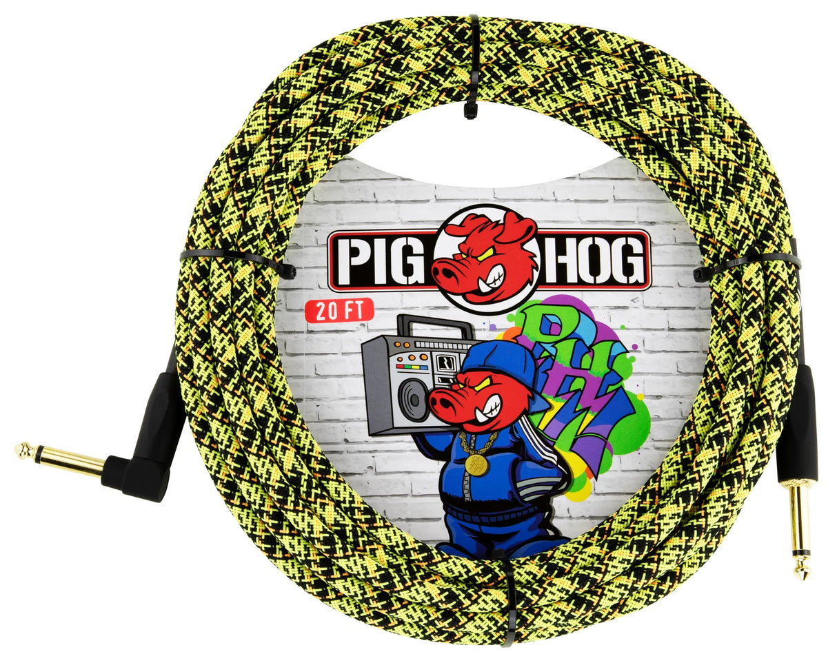 The image shows a Pig Hog 20-foot instrument cable with a yellow and black braided jacket, featuring gold-plated 1/4" TS connectors—one straight and one right-angled. The packaging displays graffiti-style artwork with the Pig Hog pig mascot and logo. This standard cable connects guitars or other instruments to audio equipment and is known for durability and affordability.