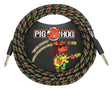 The image shows a Pig Hog 20-foot "Rasta Stripes" instrument cable with a woven fabric jacket in black, green, yellow, and red. It is coiled, featuring 1/4-inch mono jacks—one straight and one right-angle. The packaging displays the Pig Hog logo with a pig mascot playing guitar. This vintage-style cable is designed for connecting guitars, basses, and instruments to amps or audio gear.