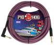 The image shows a Pig Hog "Riviera Purple" 20-foot vintage instrument cable with a purple and black braided jacket featuring a zigzag pattern. It has gold-plated 1/4" TS connectors on both ends and is coiled with cable ties. The packaging includes colorful yacht-themed artwork. This durable cable connects guitars, basses, or other instruments to amplifiers or pedals.