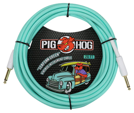 The image shows a 20-foot Pig Hog "Seafoam Green" vintage instrument cable with gold-plated 1/4" phone plugs. It features a turquoise color, Pig Hog’s cartoon pig logo, and retro packaging with a vintage truck design. Designed for electric guitars, basses, and other instruments, this professional-grade cable combines reliable performance with a distinctive, colorful vintage style.
