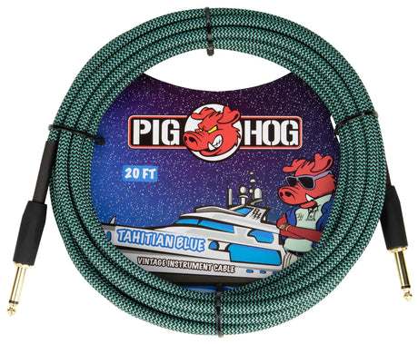 The image shows a Pig Hog "Tahitian Blue" 20-foot vintage-style instrument cable with a woven green/teal zigzag fabric jacket, gold-plated 1/4" connectors, and Pig Hog branding featuring their pig mascot. Nautical-themed artwork includes a yacht and the pig wearing sunglasses. Designed for guitars, basses, and amps, it combines reliable performance with a distinctive, eye-catching look.