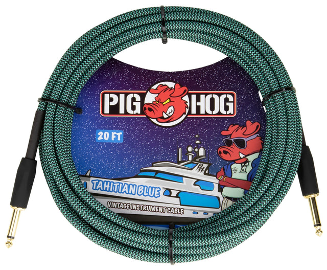 The image shows a Pig Hog "Tahitian Blue" 20-foot vintage-style instrument cable with a woven green/teal zigzag fabric jacket, gold-plated 1/4" connectors, and Pig Hog branding featuring their pig mascot. Nautical-themed artwork includes a yacht and the pig wearing sunglasses. Designed for guitars, basses, and amps, it combines reliable performance with a distinctive, eye-catching look.