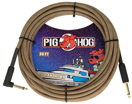 The image shows a 20-foot Pig Hog "Tuscan Brown" vintage-style instrument cable with a brown braided exterior and gold-plated 1/4" TS connectors—one straight and one right-angle. It features the Pig Hog logo with a cartoon pig mascot. The packaging has a nautical theme with the pig wearing sunglasses. This durable, vintage-look cable is used to connect guitars and other instruments to amps and pedals.