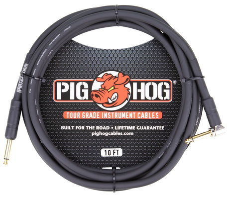 The image shows a 10-foot Pig Hog instrument cable with a black/dark gray coiled jacket and gold-plated 1/4" connectors on both ends. It features Tour Grade quality and a lifetime guarantee, as noted on the packaging. The Pig Hog logo with a cartoon pig mascot is visible. This durable cable is designed for connecting electric instruments to amps and pedals, ideal for professional musicians and live performance use.