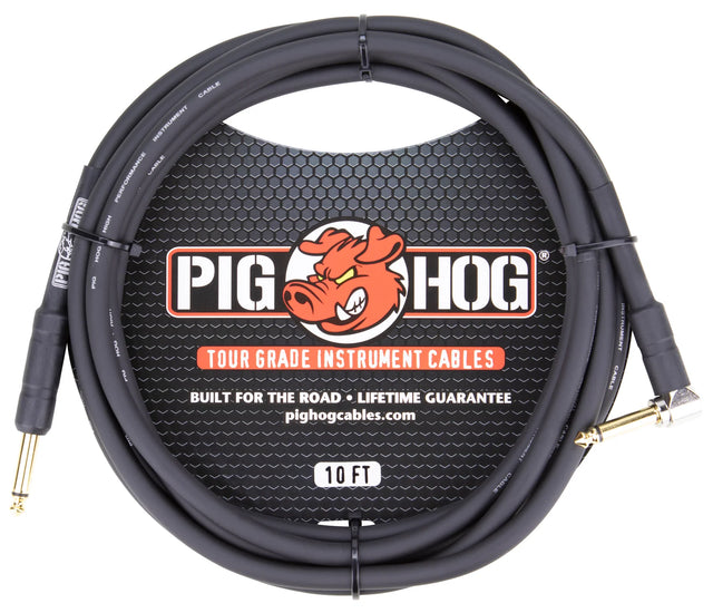 The image shows a 10-foot Pig Hog instrument cable with a black/dark gray coiled jacket and gold-plated 1/4" connectors on both ends. It features Tour Grade quality and a lifetime guarantee, as noted on the packaging. The Pig Hog logo with a cartoon pig mascot is visible. This durable cable is designed for connecting electric instruments to amps and pedals, ideal for professional musicians and live performance use.