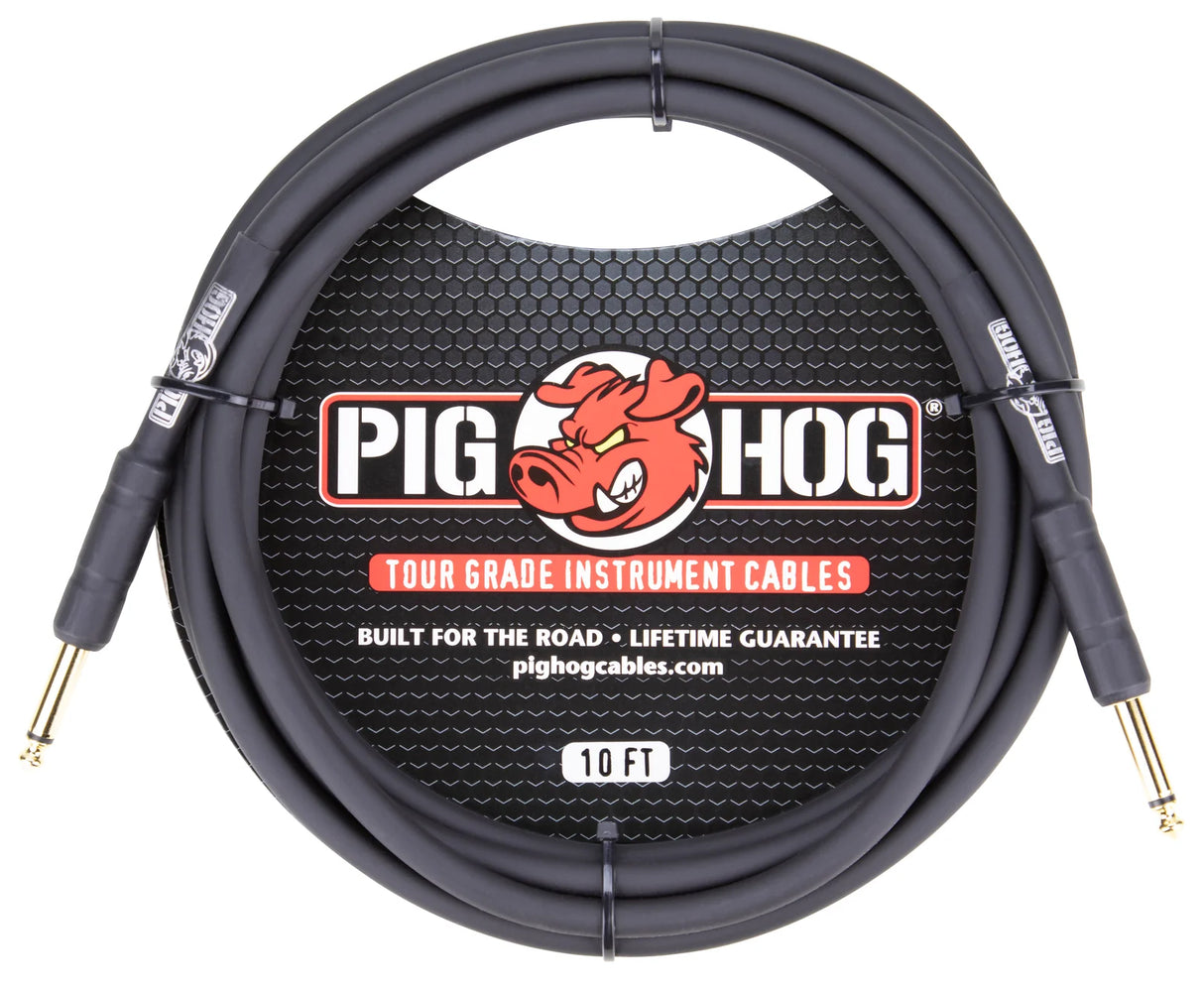 The image shows a Pig Hog Tour Grade 10-foot instrument cable with gold-plated 1/4" TS connectors and a coiled black/dark gray cable. It features the red pig mascot logo, "Built for the road," "Lifetime guarantee," and pighogcables.com on the packaging. This professional cable is designed for electric guitars, basses, and other instruments, offering durable, reliable connections ideal for live performance and frequent use.