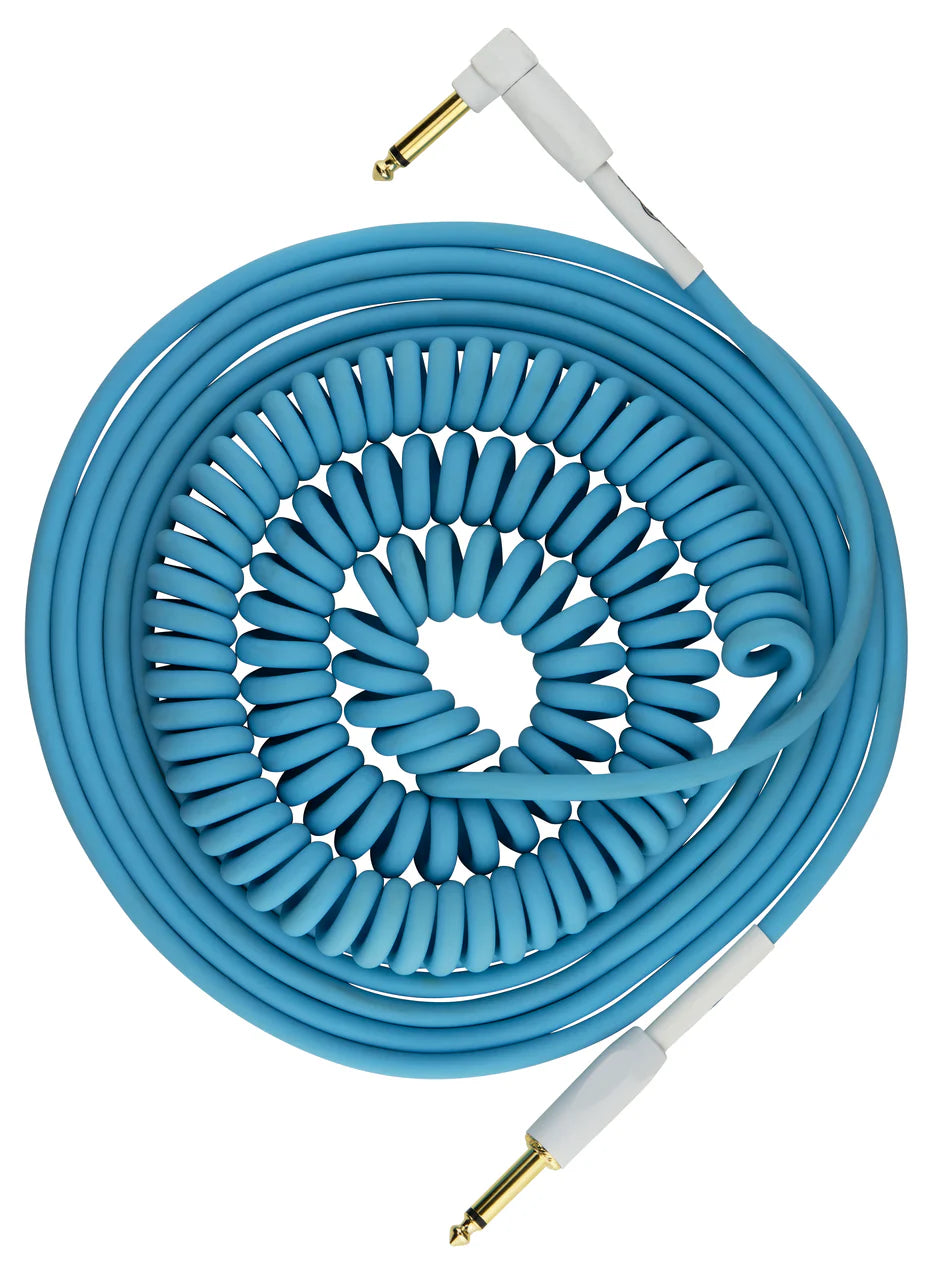 The image shows a blue/teal coiled instrument cable with gold-plated 1/4" TS connectors—one straight and one right-angle—with white housings. Designed for guitars, basses, and other instruments, its spiral design stretches for reach and retracts to prevent tangling and tripping. This high-quality cable is ideal for connecting musical gear to amps, pedals, or audio interfaces.