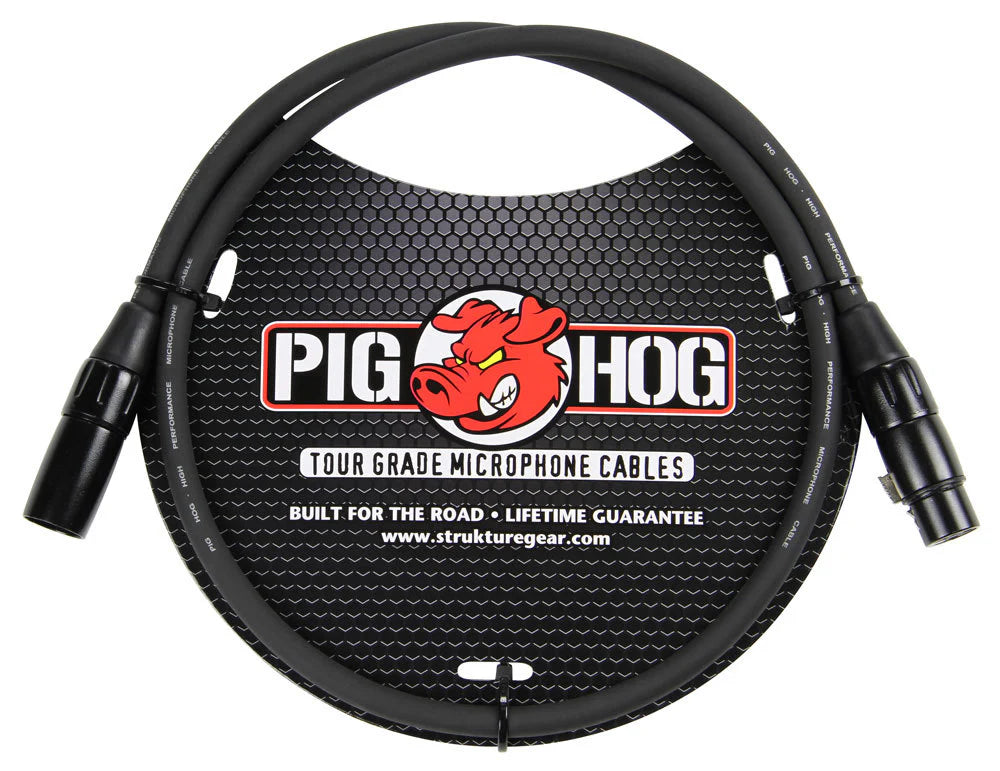 The image shows a Pig Hog Tour Grade microphone cable by Strukture Gear, featuring the red pig mascot logo. It has professional XLR male to female connectors and a black cable. Labeled "Built for the Road" with a lifetime guarantee, this durable cable is designed for professional use in live sound, recording, and studio settings.
