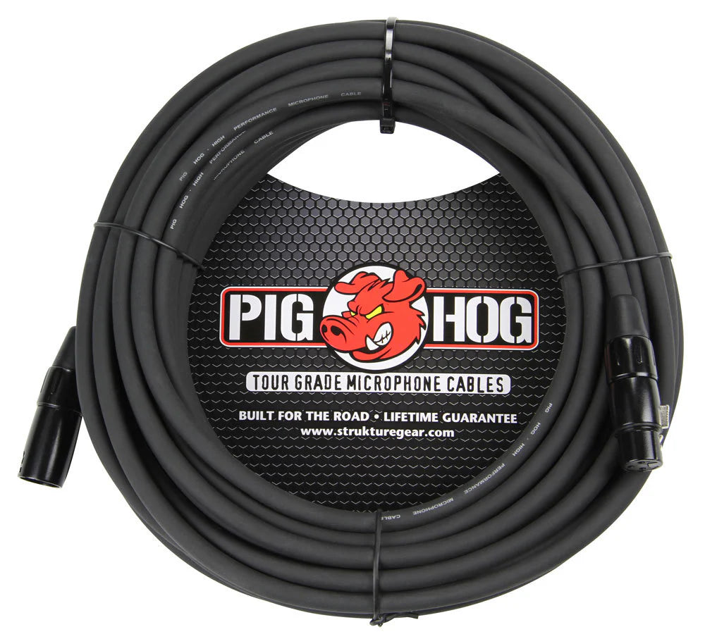 The image shows a Pig Hog Tour Grade microphone cable featuring a heavy-duty black XLR cable with professional male and female connectors. It displays the red pig mascot logo, "Built for the Road" and "Lifetime Guarantee" claims, and a circular branded label. The cable is coiled with ties, and the packaging includes the website strukturegear.com, emphasizing its professional use for live sound and studio recording.