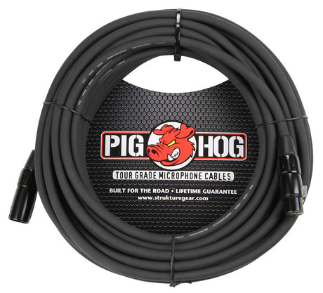 The image shows a Pig Hog Tour Grade microphone cable featuring a heavy-duty black XLR cable with professional male and female connectors. It displays the red pig mascot logo, "Built for the Road" and "Lifetime Guarantee" claims, and a circular branded label. The cable is coiled with ties, and the packaging includes the website strukturegear.com, emphasizing its professional use for live sound and studio recording.