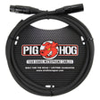 The image shows a Pig Hog tour-grade XLR microphone cable with black male and female connectors. It features heavy-duty black construction, the red Pig Hog logo, and packaging stating "Built for the Road" with a lifetime guarantee. Made by Strukture Gear, this professional cable is designed for durability and reliability in live performance and touring environments.