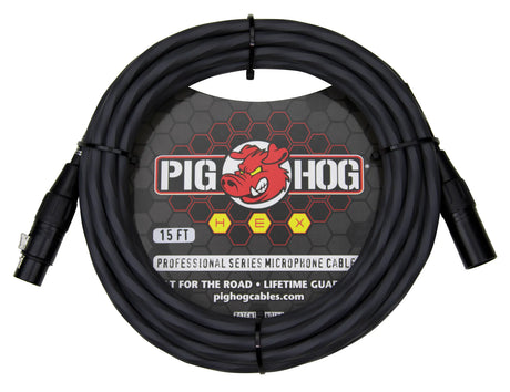 The image shows a coiled 15-foot Pig Hog Professional Series XLR microphone cable with male and female connectors. It features a black cable with the Pig Hog red pig logo, yellow "HEX" series lettering, and marketing tags "Built for the Road" and "Lifetime Guarantee." This durable cable is designed for professional audio use in music production and live sound.