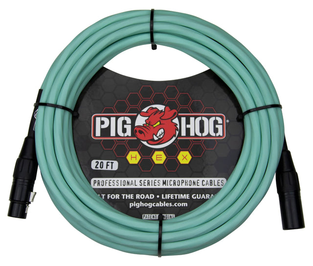 The image shows a 20-foot seafoam green Pig Hog Professional Series XLR microphone cable, coiled and secured with black ties. It features black XLR connectors, the brand’s red pig logo on black packaging, and "HEX," "Built for the Road," and "Lifetime Guarantee" labels. This durable, professional-grade cable is designed for live and studio use, easily identifiable by its distinctive color.