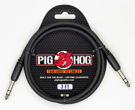 The image shows a Pig Hog Tour Grade 3-foot TRS audio cable with black metal 1/4" connectors and a black cable. It features the Pig Hog red pig logo, is built for durability with a lifetime guarantee, and is designed for professional use in balanced audio connections, instruments, mixing boards, and studio or live sound applications.
