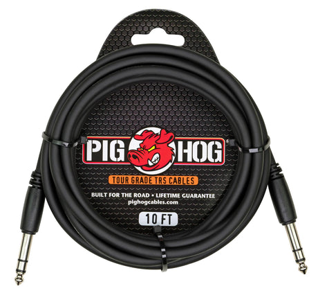 The image shows a Pig Hog Tour Grade 10-foot TRS audio cable with two 1/4-inch metal housing connectors. It features a black, heavy-duty design and the Pig Hog logo with a red pig mascot. The packaging highlights its rugged, road-ready build, lifetime guarantee, and professional tour-grade quality, ideal for balanced audio connections in live performance and studio settings.