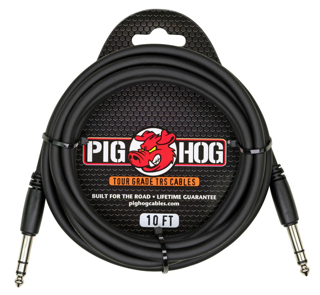 The image shows a Pig Hog Tour Grade 10-foot TRS audio cable with two 1/4-inch metal housing connectors. It features a black, heavy-duty design and the Pig Hog logo with a red pig mascot. The packaging highlights its rugged, road-ready build, lifetime guarantee, and professional tour-grade quality, ideal for balanced audio connections in live performance and studio settings.