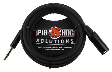 The image shows a black professional audio cable from Pig Hog Solutions with a 1/4" TRS connector on one end and an XLR connector on the other. It features the Pig Hog red pig logo and "SOLUTIONS" text. Labeled "Built for the Road" with a lifetime guarantee, this durable cable is used for connecting instruments, microphones, and audio gear. The packaging displays www.strukturegear.com, indicating it’s part of their professional audio lineup.