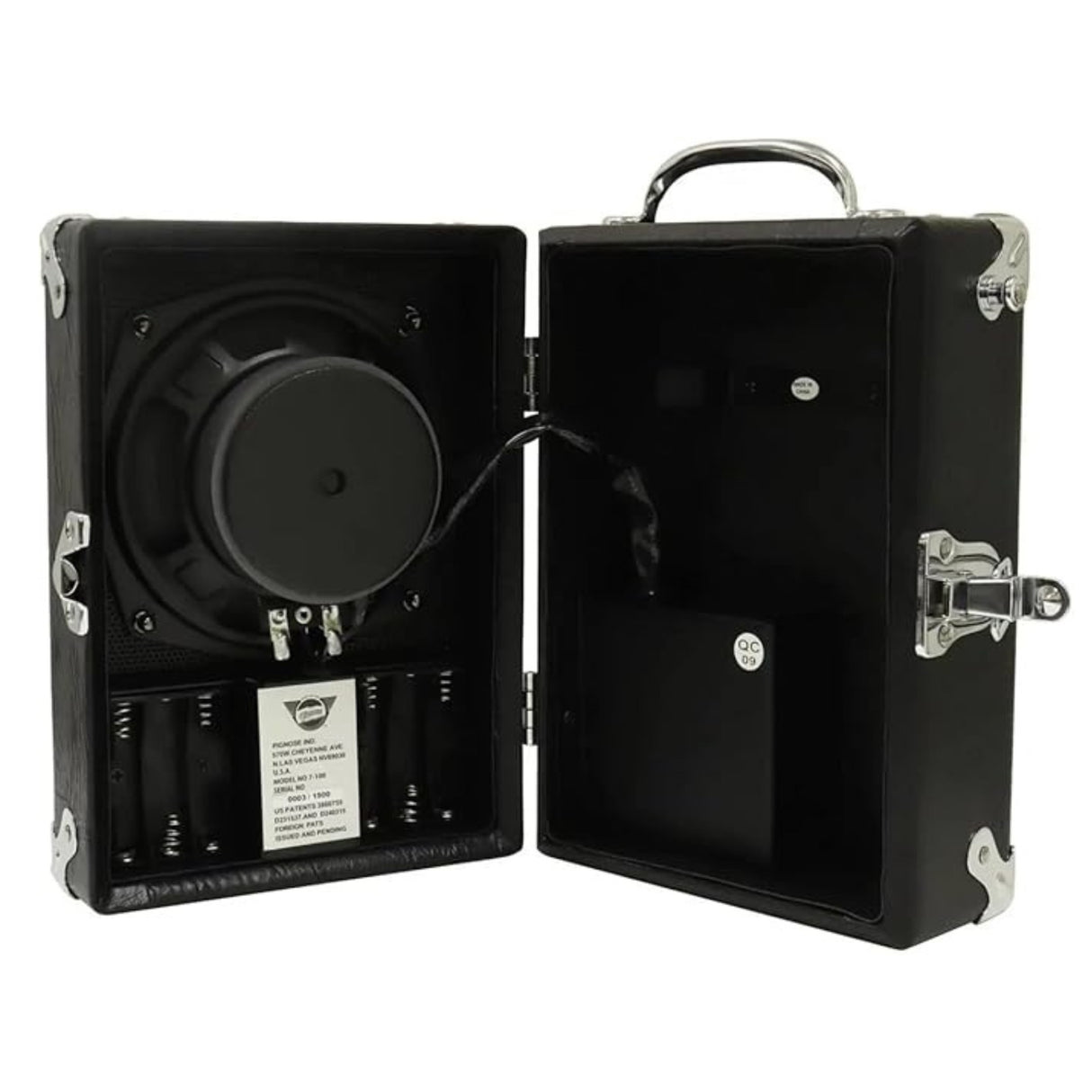 The image shows a portable DJ turntable inside a black briefcase-style carrying case. It features a black vinyl platter on the left, a tonearm, and a black foam-padded interior. The case has chrome hardware, including hinges, latches, and a handle. A product label is visible in the lower left. Designed for easy transport, this durable turntable system is ideal for DJs and music enthusiasts on the go.
