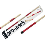 The image shows a pair of Pro-Mark Hot Rod drumsticks, which consist of multiple thin birch dowels bundled together with red grips. They are packaged in a clear plastic case with the Pro-Mark logo. Hot Rods produce a softer, more subtle sound than traditional sticks, ideal for acoustic or jazz settings, offering a unique timbre between brushes and regular drumsticks.