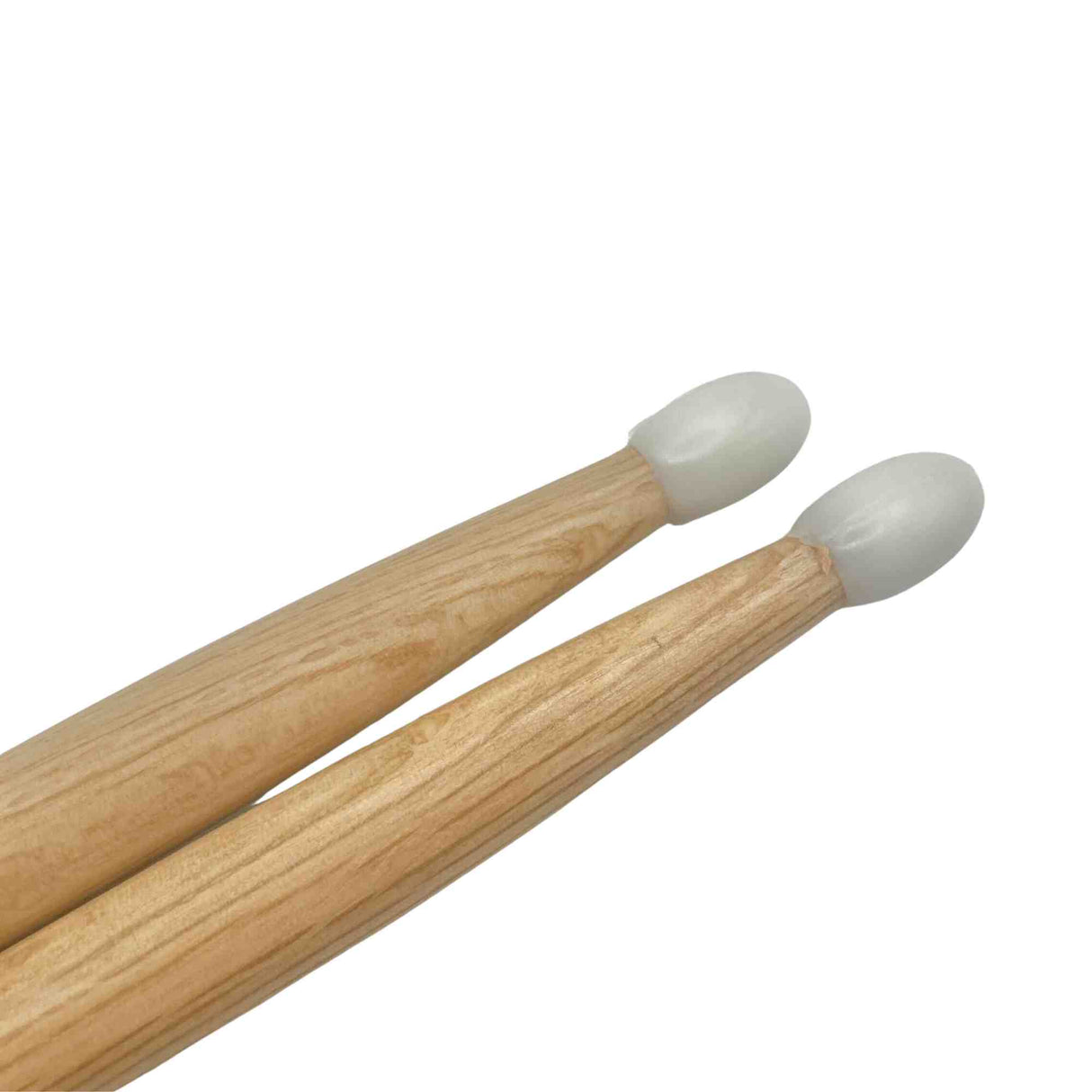 The image shows a pair of natural wood drumsticks with visible grain and white nylon tips. These drumsticks are common percussion accessories used by drummers. The nylon tips provide a brighter, more articulate sound and greater durability compared to wooden tips. Suitable for various drumming styles, they have a clean, professional appearance and are essential equipment for playing drum kits and percussion instruments.