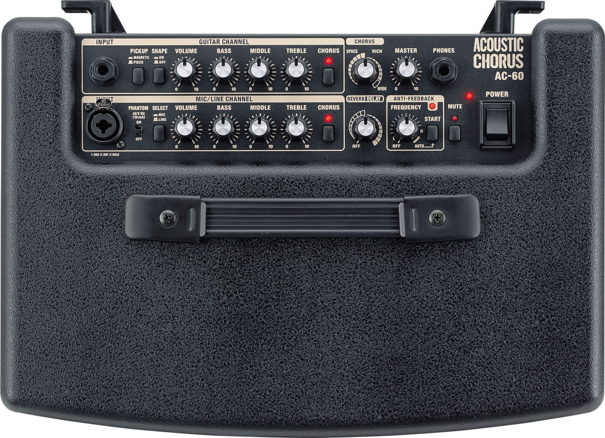 The image shows an Acoustic Chorus AC-60 guitar amplifier designed for acoustic instruments. It features two input channels: guitar and mic/line, both with volume, bass, middle, treble, and chorus controls. Additional features include built-in chorus, reverb/delay, anti-feedback, master volume, headphone output, and phantom power. It has a compact, dark gray/black textured design with multiple knobs and input jacks.