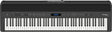 The image shows a Roland digital piano with 88 full-size weighted keys, simulating an acoustic piano feel. It features a sleek black finish, a control panel with buttons, sliders, and a small LCD display for sound selection and adjustments. Roland branding is visible in the top right corner. This versatile instrument is popular with pianists and producers for its authentic touch and digital functionality.