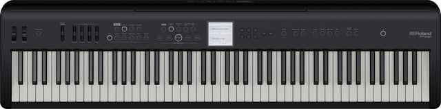 The image shows a Roland digital piano with classic black and white keys in a standard layout. Above the keys is a control panel featuring buttons, sliders, and a small central display screen. The Roland logo is visible in the top right corner. This digital piano replicates an acoustic piano’s feel and sound while offering additional features like multiple instrument voices, recording options, and sound effects.