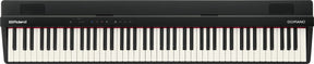 The image shows a Roland GO:PIANO digital keyboard with a full-size 88-key layout featuring traditional black and white keys. It has a sleek black body, the Roland logo on the left, "GO:PIANO" on the right, control buttons and indicators on the top panel, and ventilation grilles at both ends. This compact, portable digital piano is designed for beginners and musicians seeking an affordable, lightweight alternative to acoustic pianos.