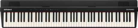 The image shows a Roland GO:PIANO digital keyboard with a full-size 88-key layout featuring traditional black and white keys. It has a sleek black body, the Roland logo on the left, "GO:PIANO" on the right, control buttons and indicators on the top panel, and ventilation grilles at both ends. This compact, portable digital piano is designed for beginners and musicians seeking an affordable, lightweight alternative to acoustic pianos.