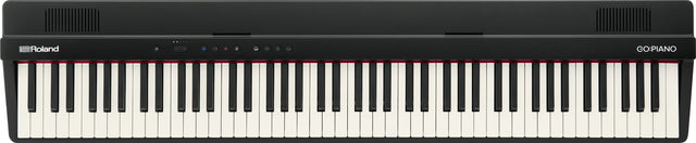 The image shows a Roland GO:PIANO digital keyboard with a full-size 88-key layout featuring traditional black and white keys. It has a sleek black body, the Roland logo on the left, "GO:PIANO" on the right, control buttons and indicators on the top panel, and ventilation grilles at both ends. This compact, portable digital piano is designed for beginners and musicians seeking an affordable, lightweight alternative to acoustic pianos.
