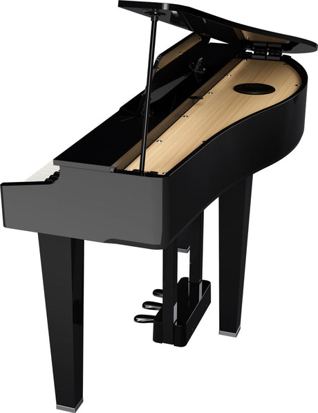 The image shows a baby grand piano with a black polished finish and its lid open, revealing the light wooden soundboard. It features the curved body shape, three legs, pedals at the base, and a fallboard covering the keys. This high-quality acoustic piano is suited for home use or small venues, commonly favored by serious pianists for its elegant design and rich sound projection.
