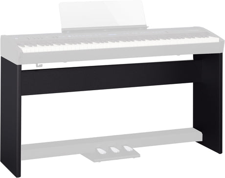 The image shows a black wooden or composite keyboard stand designed to support a digital piano or electronic keyboard. It features a solid rectangular frame with a dark finish, a horizontal support surface, and a lower shelf. The sleek, furniture-style design provides stable, permanent support, ideal for home studios or practice rooms, contrasting with portable folding stands.
