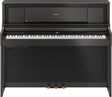 The image shows a Roland digital piano in a compact upright cabinet with a dark wood finish. It has a full 88-key weighted keyboard, a digital control panel with buttons and a small display, three pedals, and Roland branding on the music rack. This stylish, space-saving piano combines the feel of an acoustic piano with digital features like volume control and multiple voices, ideal for home use.