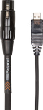 The image shows a Roland audio cable with a black 3-pin XLR connector on one end and a USB connector on the other. The black cable features visible "Roland" branding and orange accent arrows on the sleeve. This cable connects professional audio gear with XLR outputs to computers or digital devices via USB, commonly used by musicians and audio engineers to link analog and digital equipment.