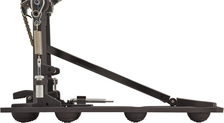 The image shows a bass drum pedal with a metal frame, textured footboard, chain drive, tension spring, and adjustable beater assembly. It includes multiple adjustment points for customizing feel and response. This professional-grade pedal enables drummers to strike the bass drum with their foot while keeping hands free for other instruments.